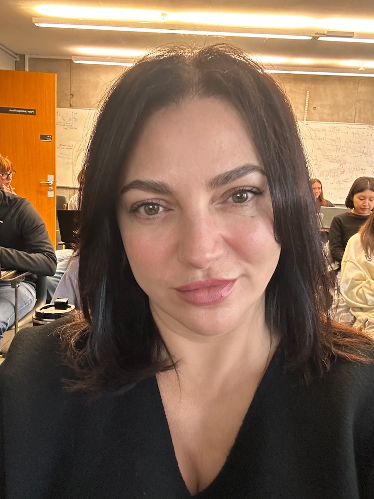 Eteri McKenzie, Solution Focused Hypnotherapist in Edinburgh, attending a neuroscience lecture at the University of Edinburgh as part of her MSc studies.